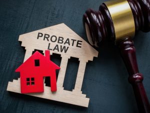 Probate law. Gavel and house model.